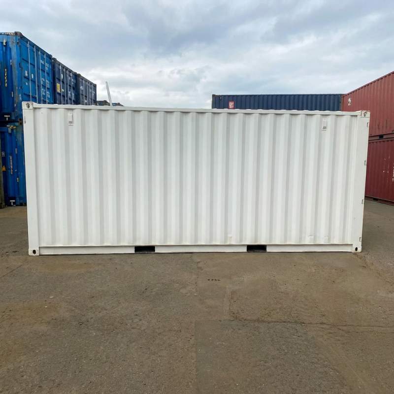 Outdoor dry box container with smooth light color steel body prepared for transport by a China container manufacturing factory