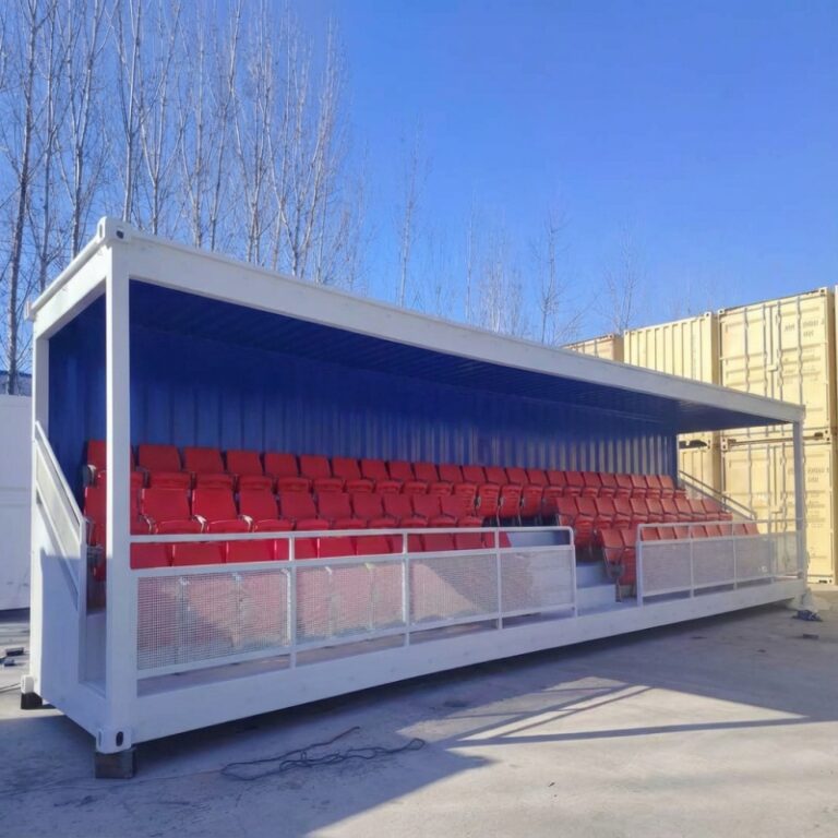 A custom-designed shipping container grandstand featuring red seating, ideal for large outdoor events and sports venues. This high-quality structure is tailored for durability and comfort.