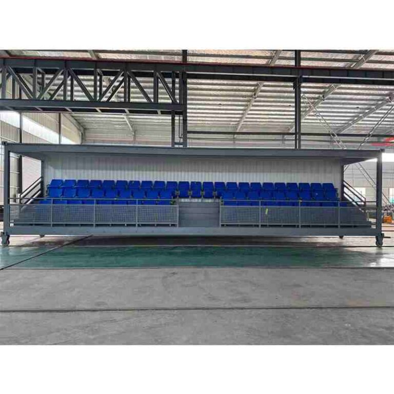 container bleacher opened into multi-tier elevated seating platform with integrated stairs and guardrails ready for crowd use at sports or event sites
